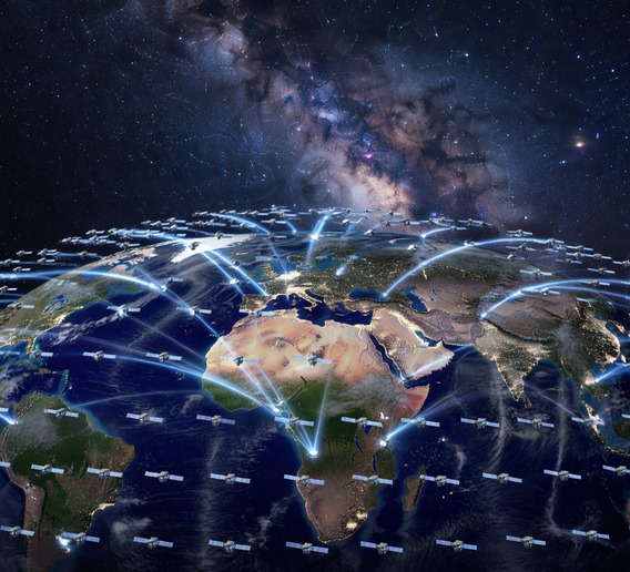 Epic photorealistic visualization of thousands of small LEO satellites forming a dense luminous web around Earth as seen from low orbit, blue-white signal beams connecting satellites to ground terminals across Africa, Asia, and the Americas, ultra-detailed Earth surface with city lights visible below, deep space background with the Milky Way, cinematic wide-angle composition, 8K resolution scientific illustration style