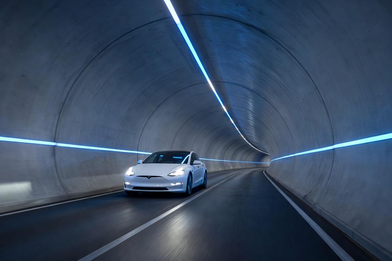 Futuristic underground tunnel transit system glowing with blue LED lighting beneath a major city
